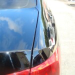 Before and after photographs of a damaged black Volkswagon Jetta that was repaired by Elite Paint & Body Shop in West Palm Beach, Florida.